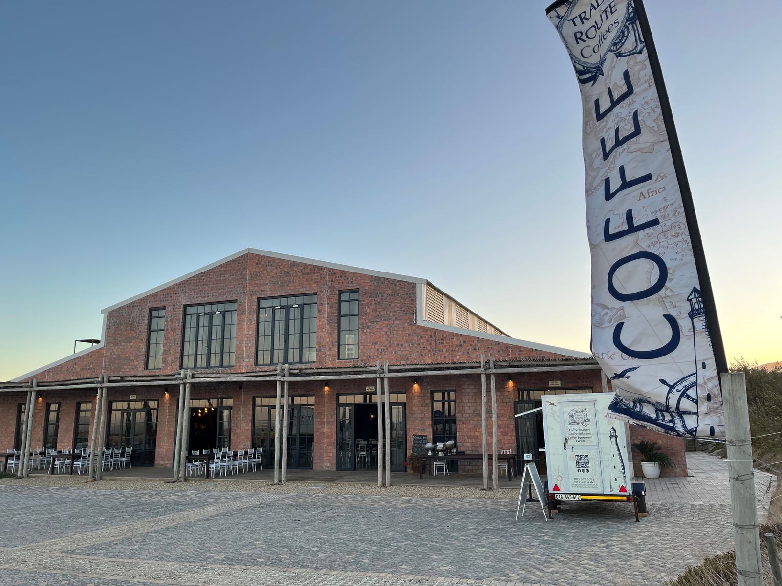 The Trade Route Coffees trailer set up at a Cape Town venue at sunset